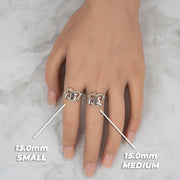 Two tri-color Quinceañera heart rings with size labels worn on a model's hand.