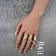 three 10k - 14k Gold ring on a hand with size measurements labeled on a gray background