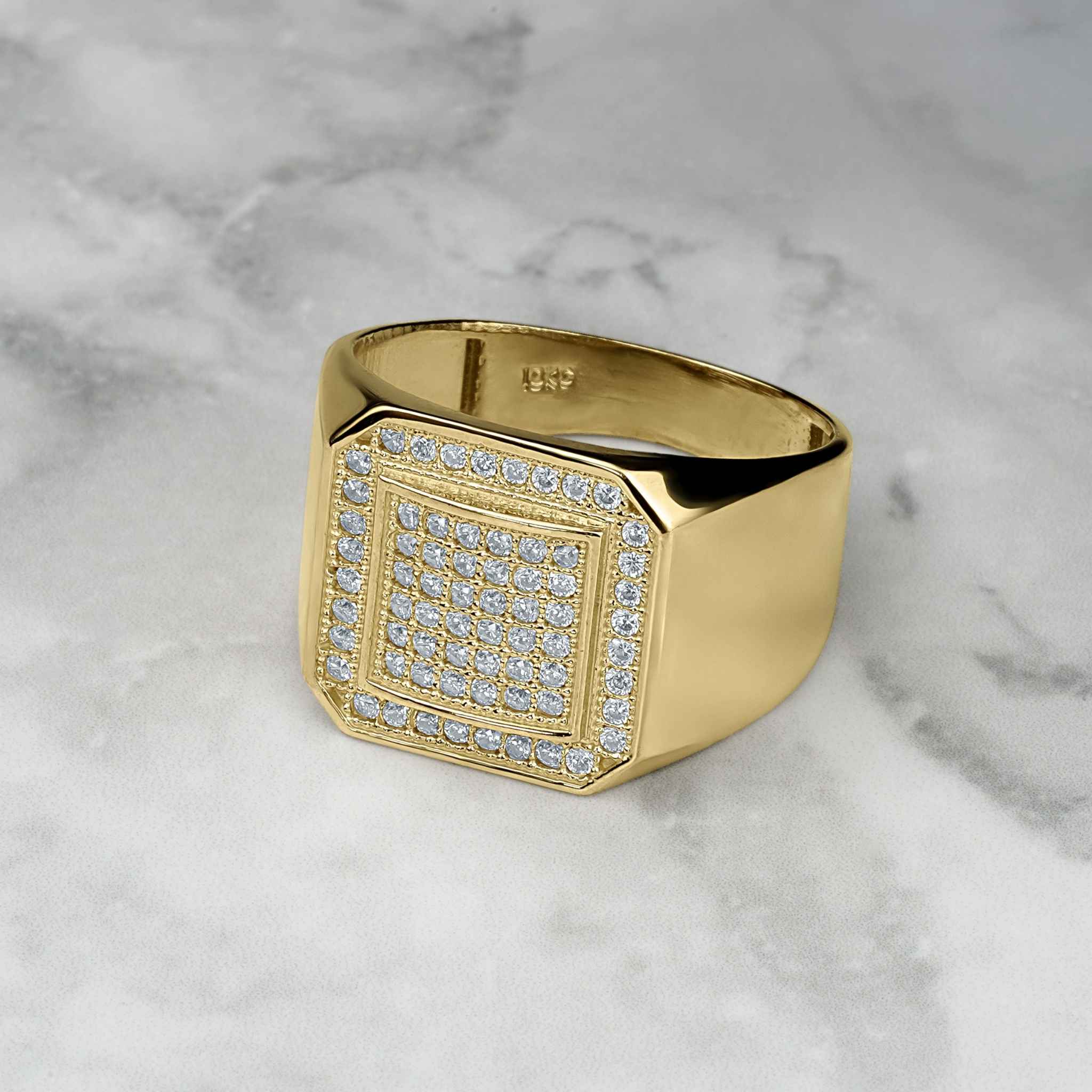 Polished yellow gold signet ring featuring a glittering, pavé-set square face of cubic zirconia.