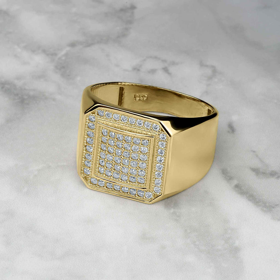 Polished yellow gold signet ring featuring a glittering, pavé-set square face of cubic zirconia.
