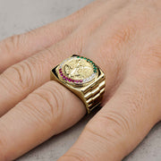 10k - 14k Gold ring with Cubic Zirconia on a finger against a neutral background