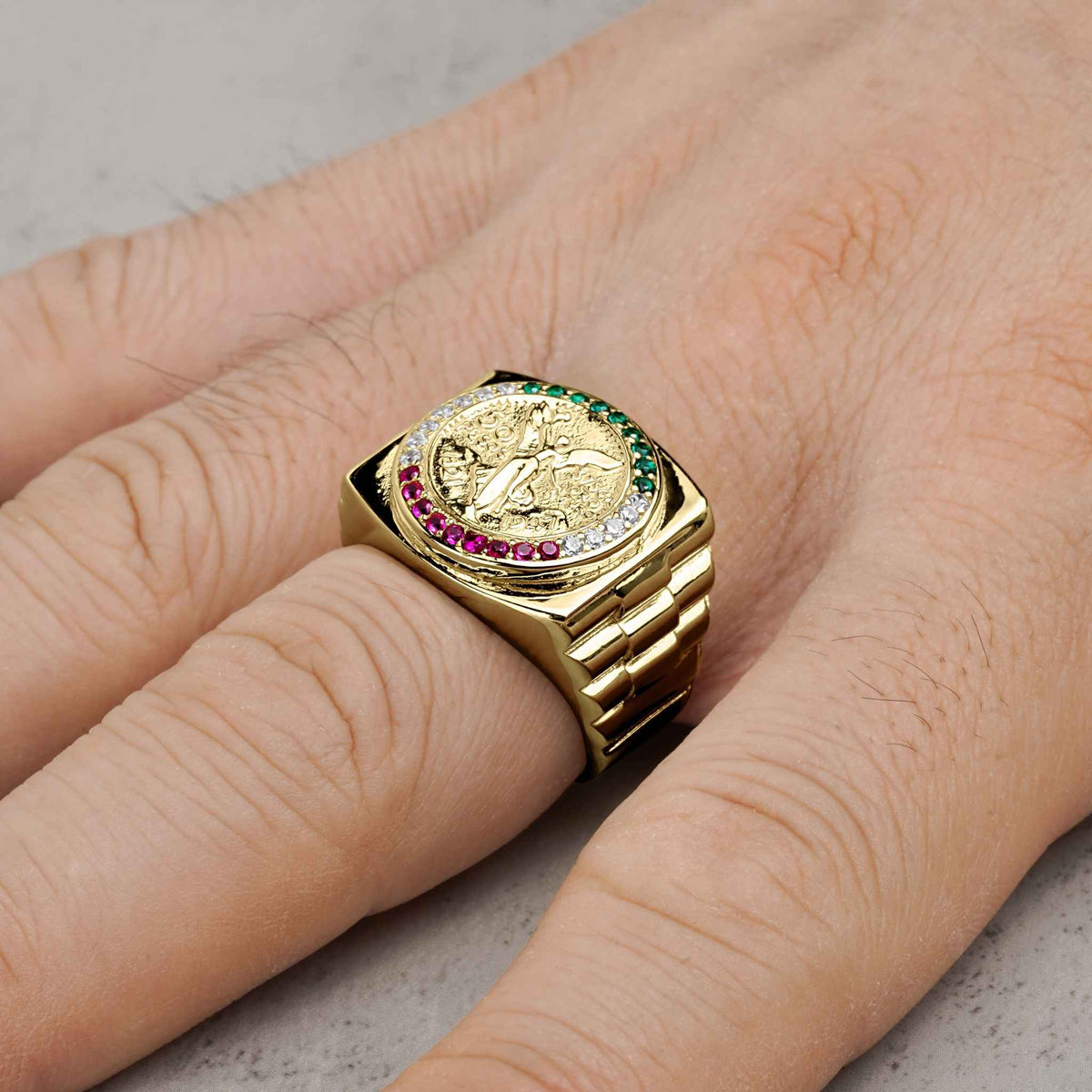 10k - 14k Gold ring with Cubic Zirconia on a finger against a neutral background