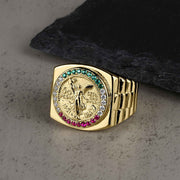 10k & 14k Gold Rexo Centenario ring with Cubic Zirconia accents on a textured surface