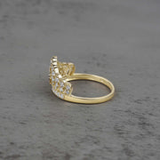 10k - 14k gold ring with cubic zirconia accents side view on a gray surface
