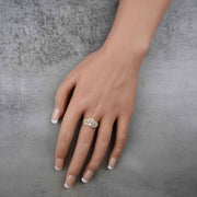 hand wearing a 10k -14k gold ring with a crown shape and number 15 design 