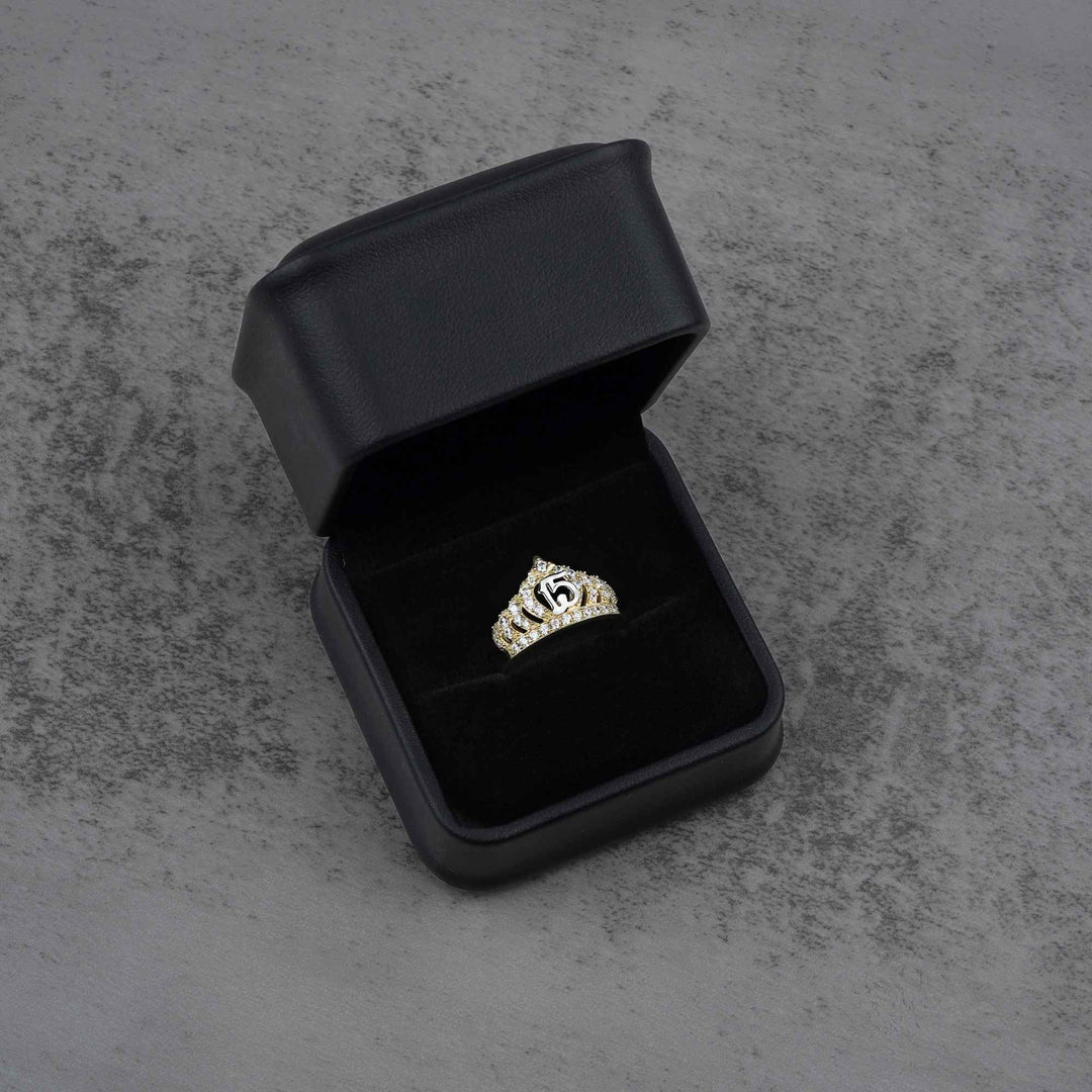 10k - 14k gold ring with a crown and number 15 design in a black jewelry box 