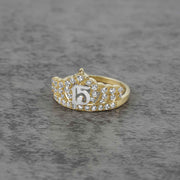 10k - 14k gold ring with number 5 and cubic zirconia accents on a gray surface