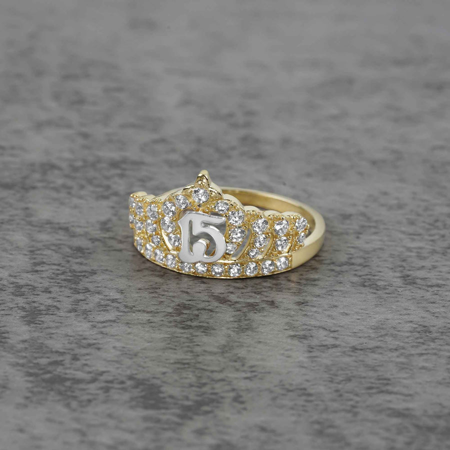 10k - 14k gold ring with number 5 and cubic zirconia accents on a gray surface