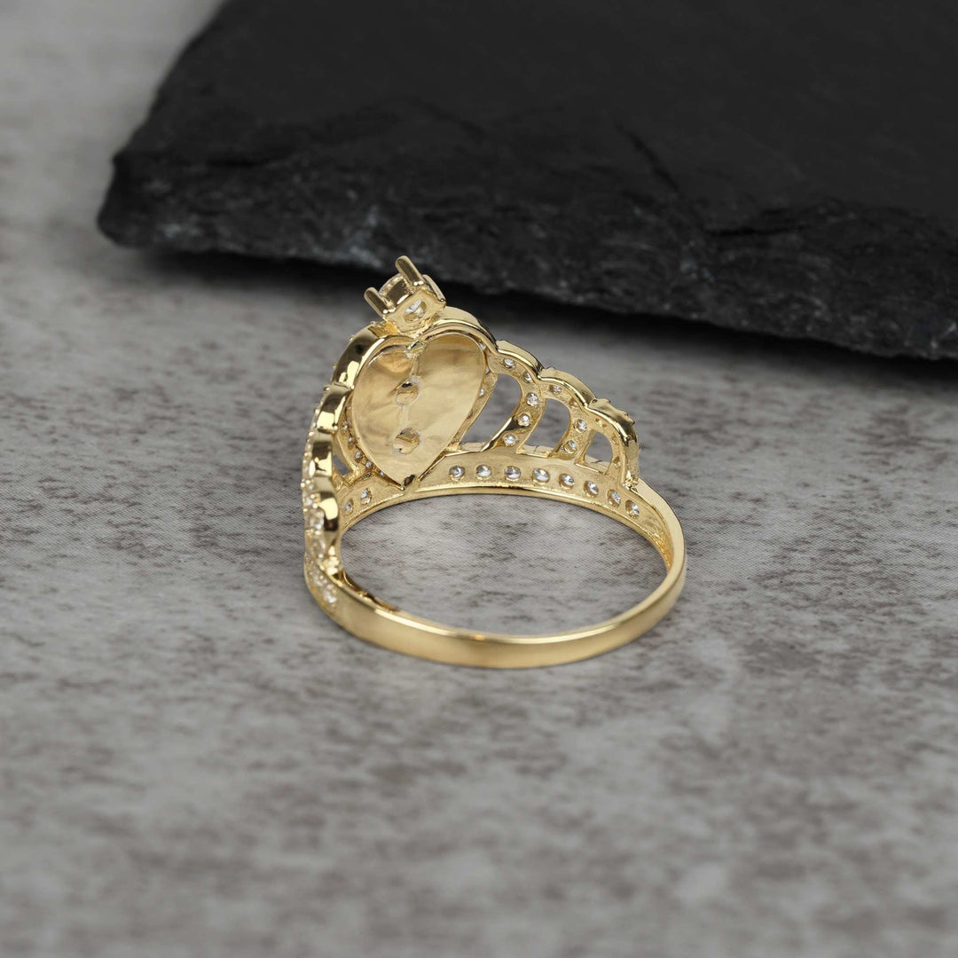 Back angle of 14k gold royal quinceanera crown ring with cubic zirconia stones.