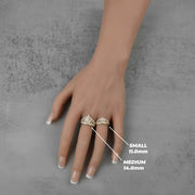 Small and medium gold royal crown rings on a hand with size labels.