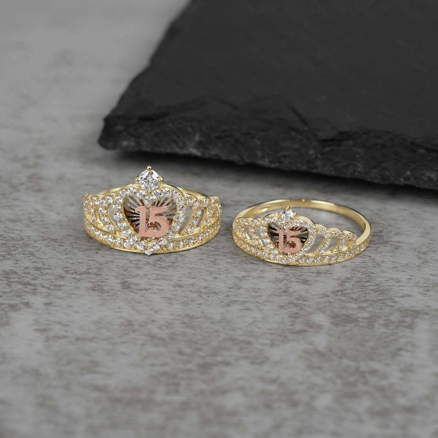 Large and medium gold crown rings with a rose gold 15 on stone