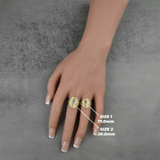 Hand wearing two 10k - 14k  Classic Saint Benedict Oval gold rings with size labels 