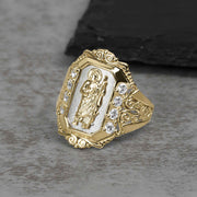 Two-tone gold San Judas royal ring featuring cubic zirconia stones on a gray background.
