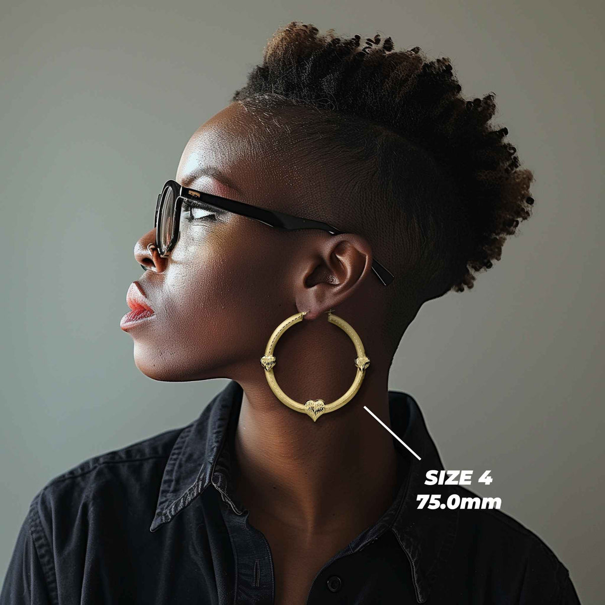 Side profile of a model wearing the 75.0mm Size 4 gold tre heart hoop.