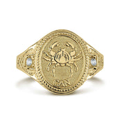 10k or 14k gold Cancer zodiac signet CZ ring on a white background.