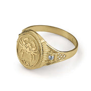 Yellow gold Cancer crab signet ring with textured band and cubic zirconia accents.