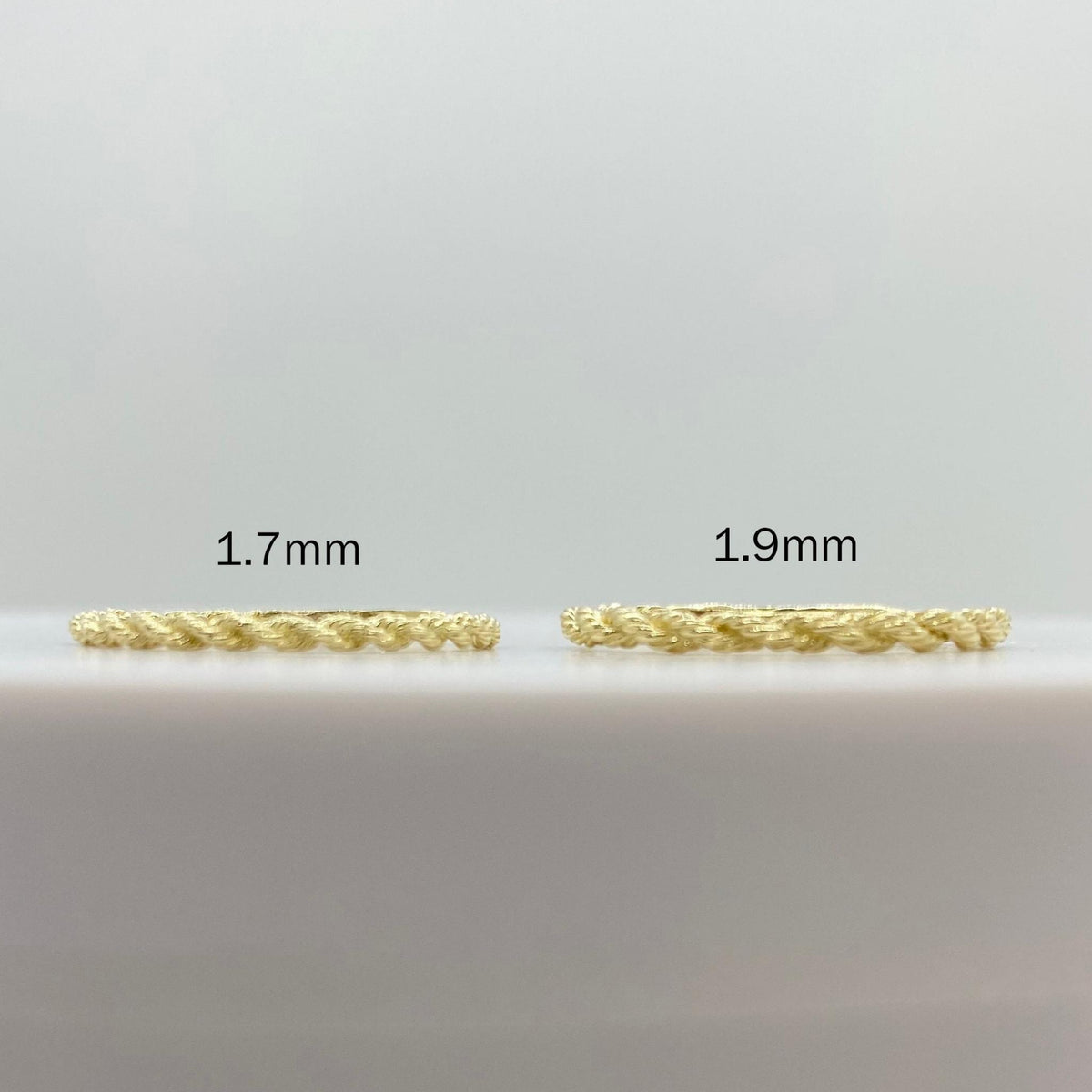 10k gold ultra slim rope ring on a white background, front view