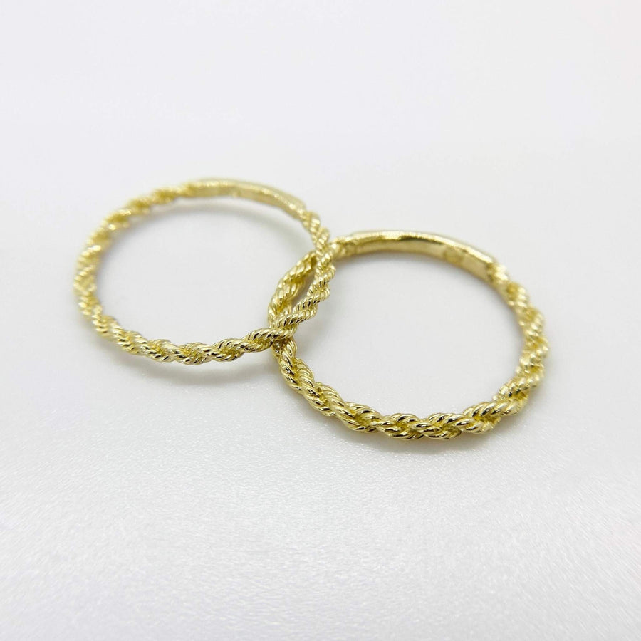 10k-14k solid gold rope band ring stacked with other rings