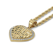 Close-up of the gold heart nugget pendant bail connected to a textured rope chain.