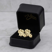 10k and 14k gold vintage nugget stud earrings inside an open black jewelry box.