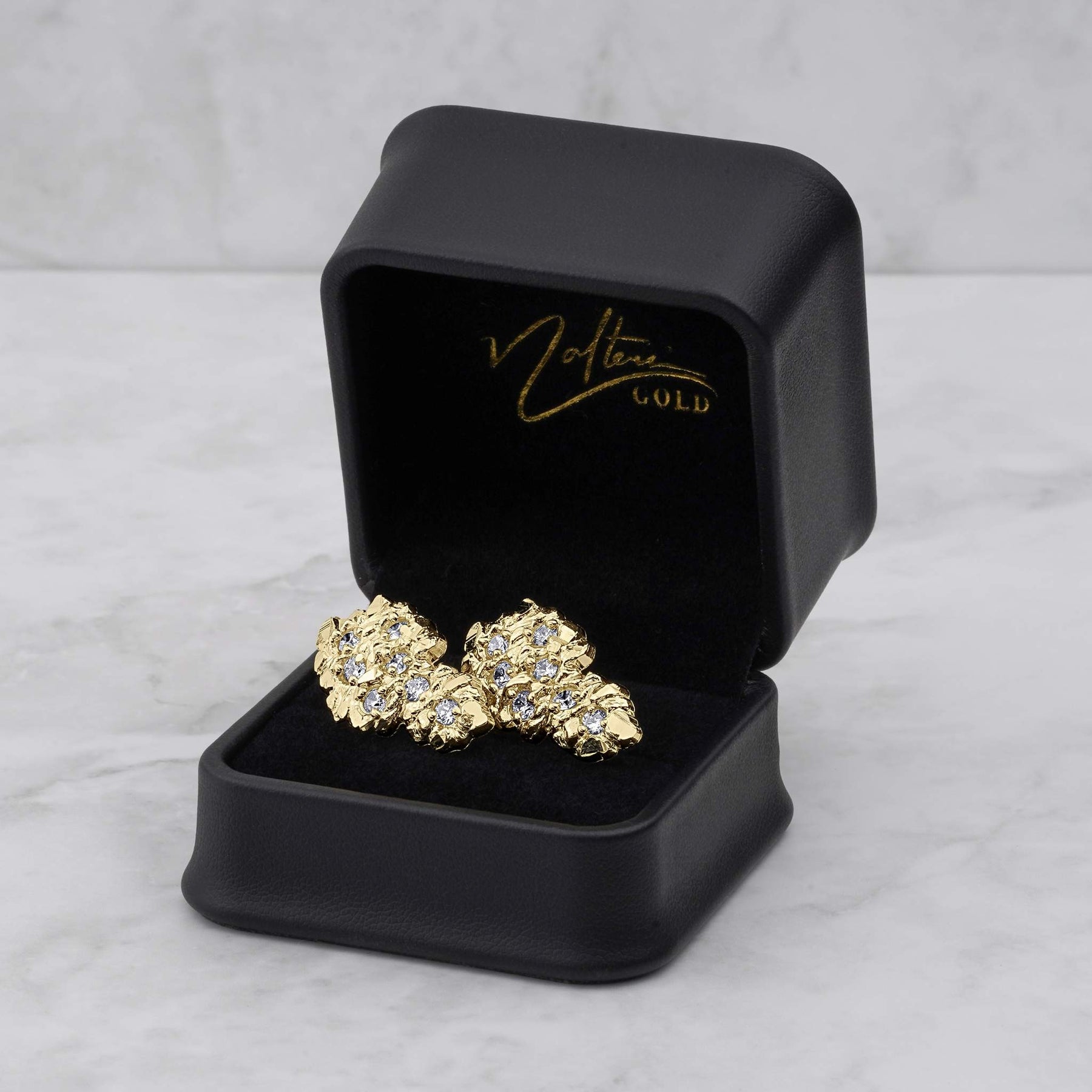 10k and 14k gold vintage nugget CZ stud earrings displayed in a black jewelry box.