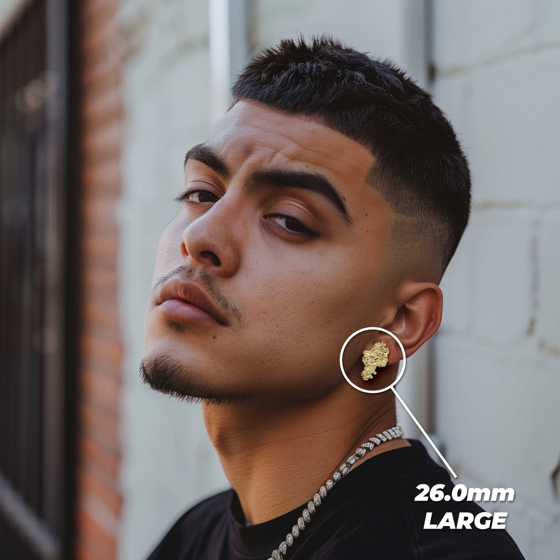 Male model wearing a large 26.0mm gold vintage nugget stud earring.
