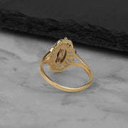 Back view of the tricolor gold Virgin Mary ring displaying its solid polished band.