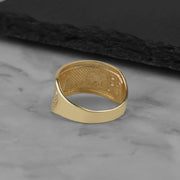 Underside view of a tricolor gold elephant ring showcasing its hollow-backed interior structure.