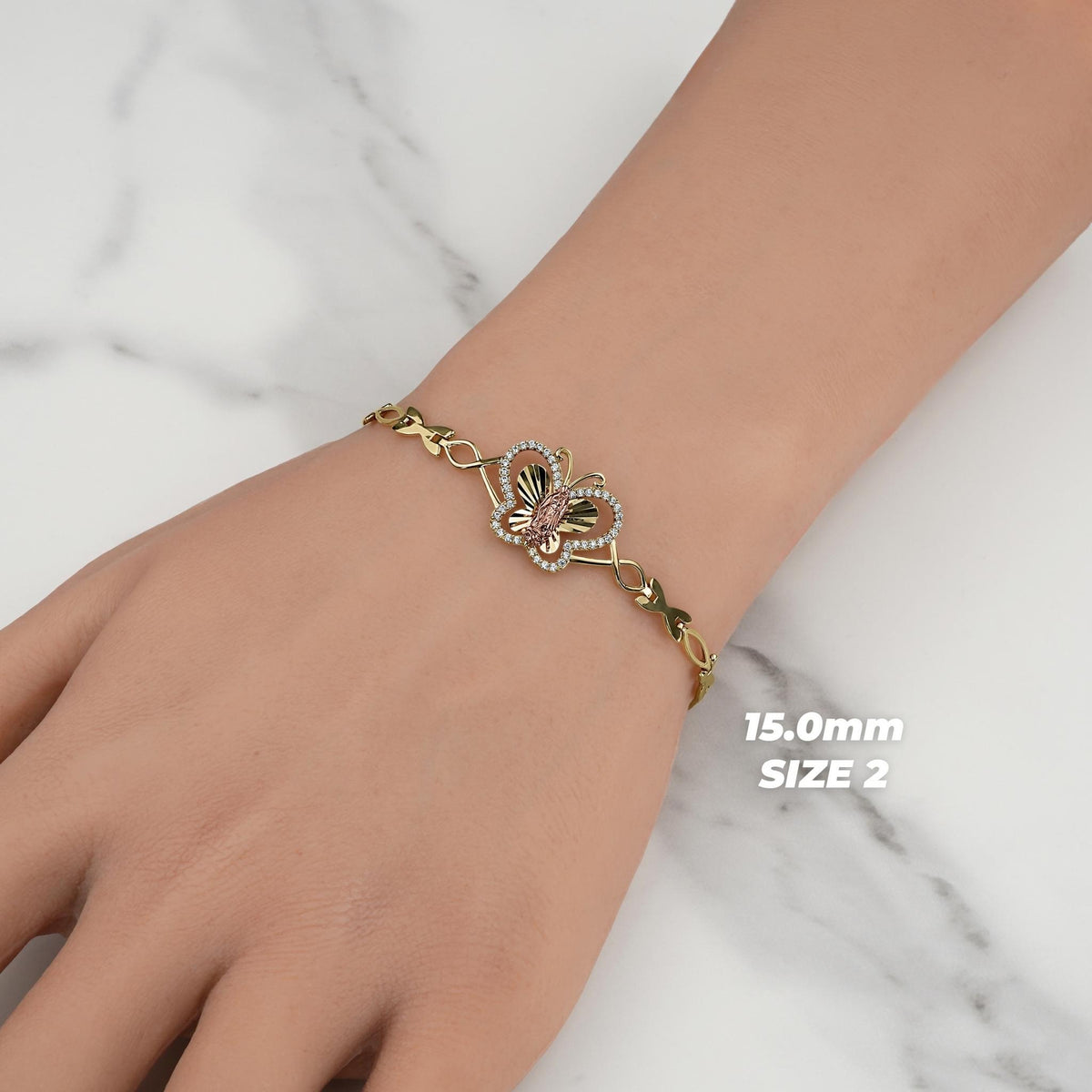 Gold 15.0mm Size 2 Virgin Mary butterfly bracelet worn on a wrist.