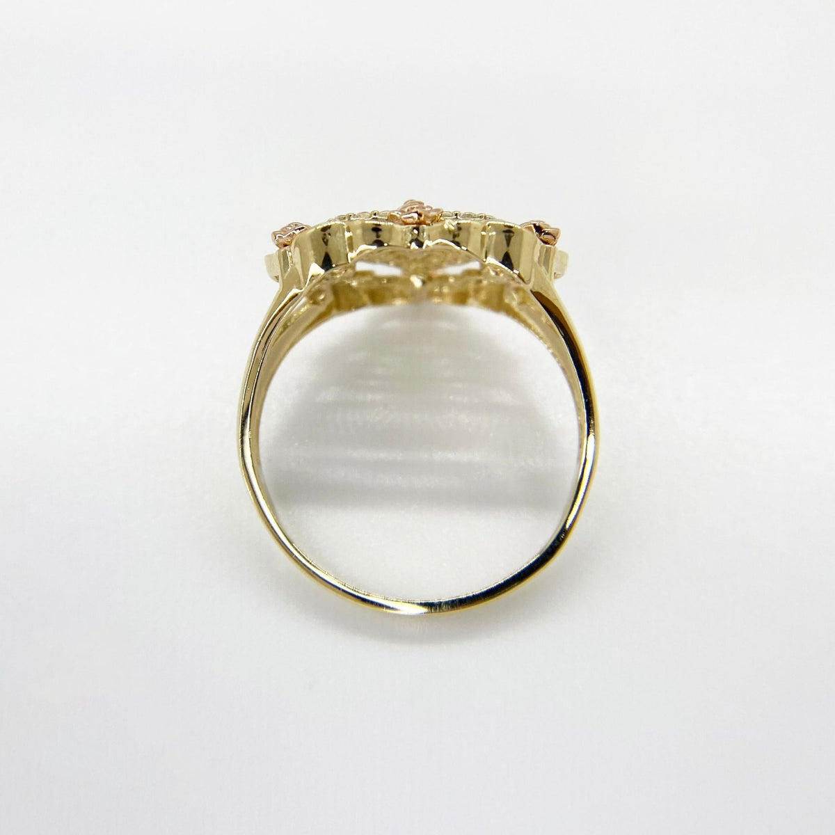 10k - 14k Gold heart shape ring top view on a white background