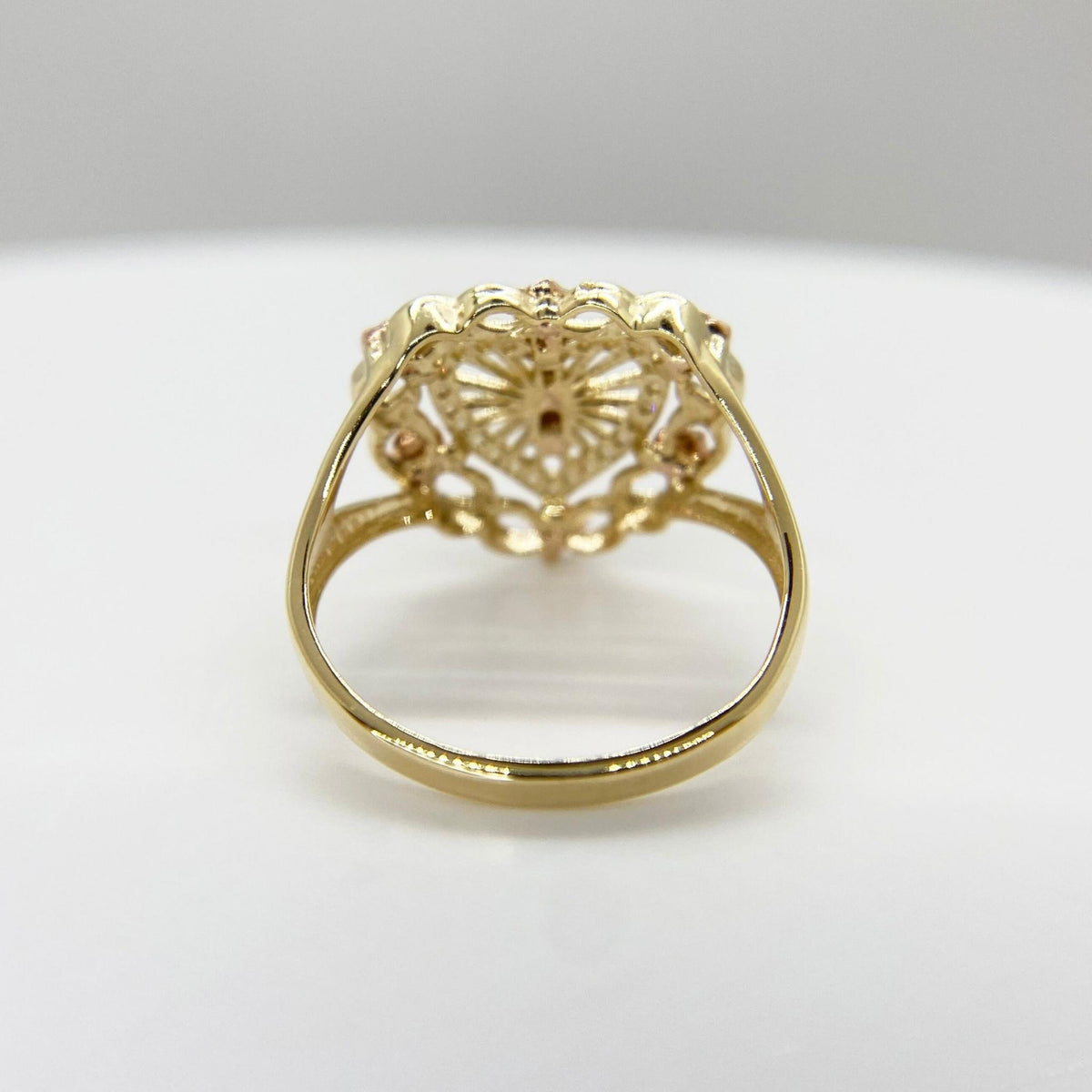 10k - 14k Gold heart ring with intricate design back view on a white background 