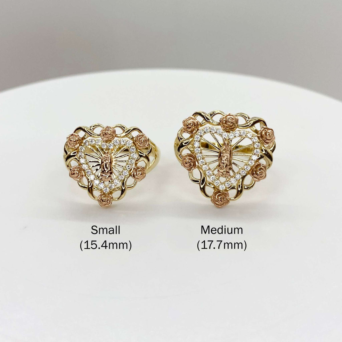 10k - 14k Heart shaped rings with rose design and size labels on a white background
