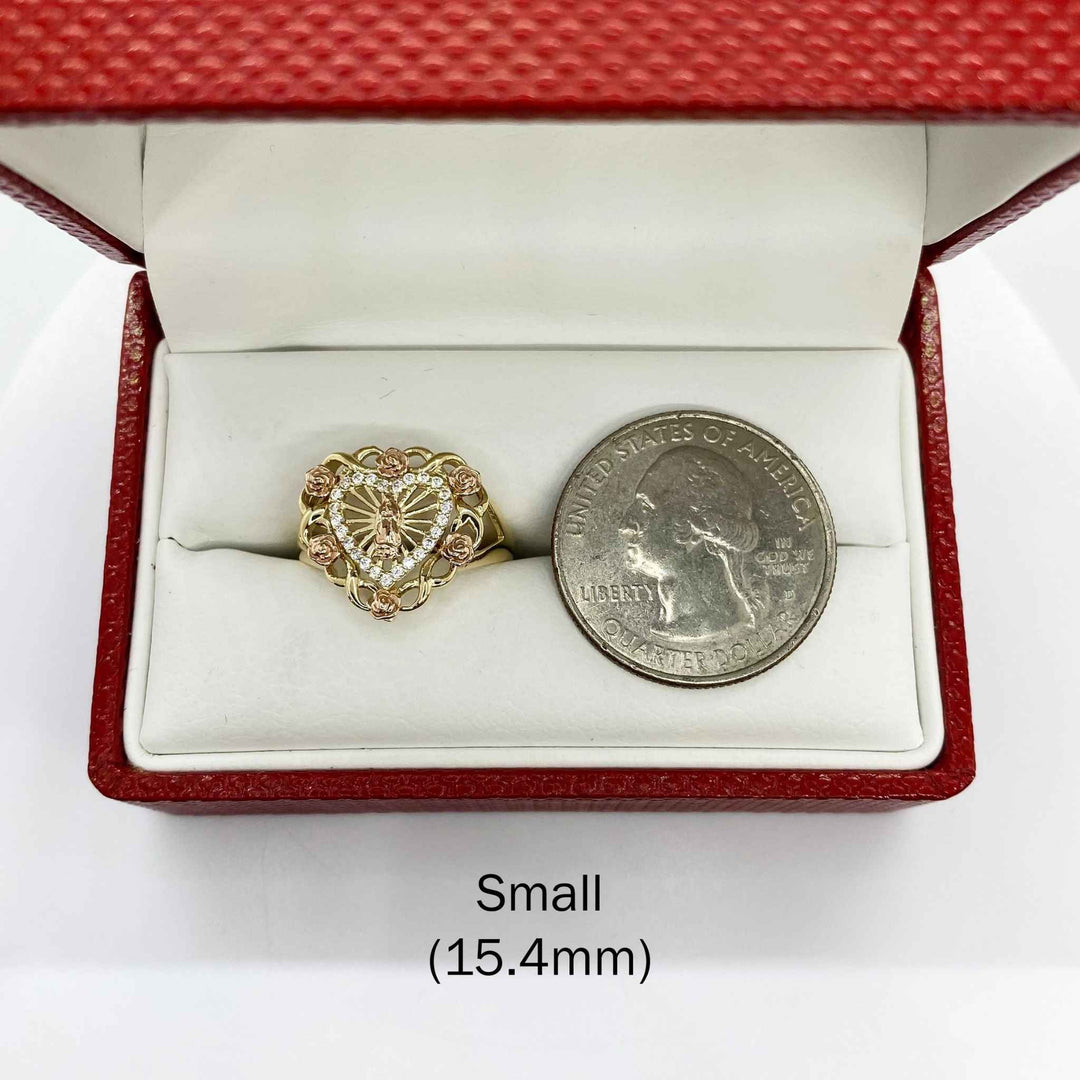 10k - 14k Heart shaped ring with roses in a red box with a quarter for scale on a white background