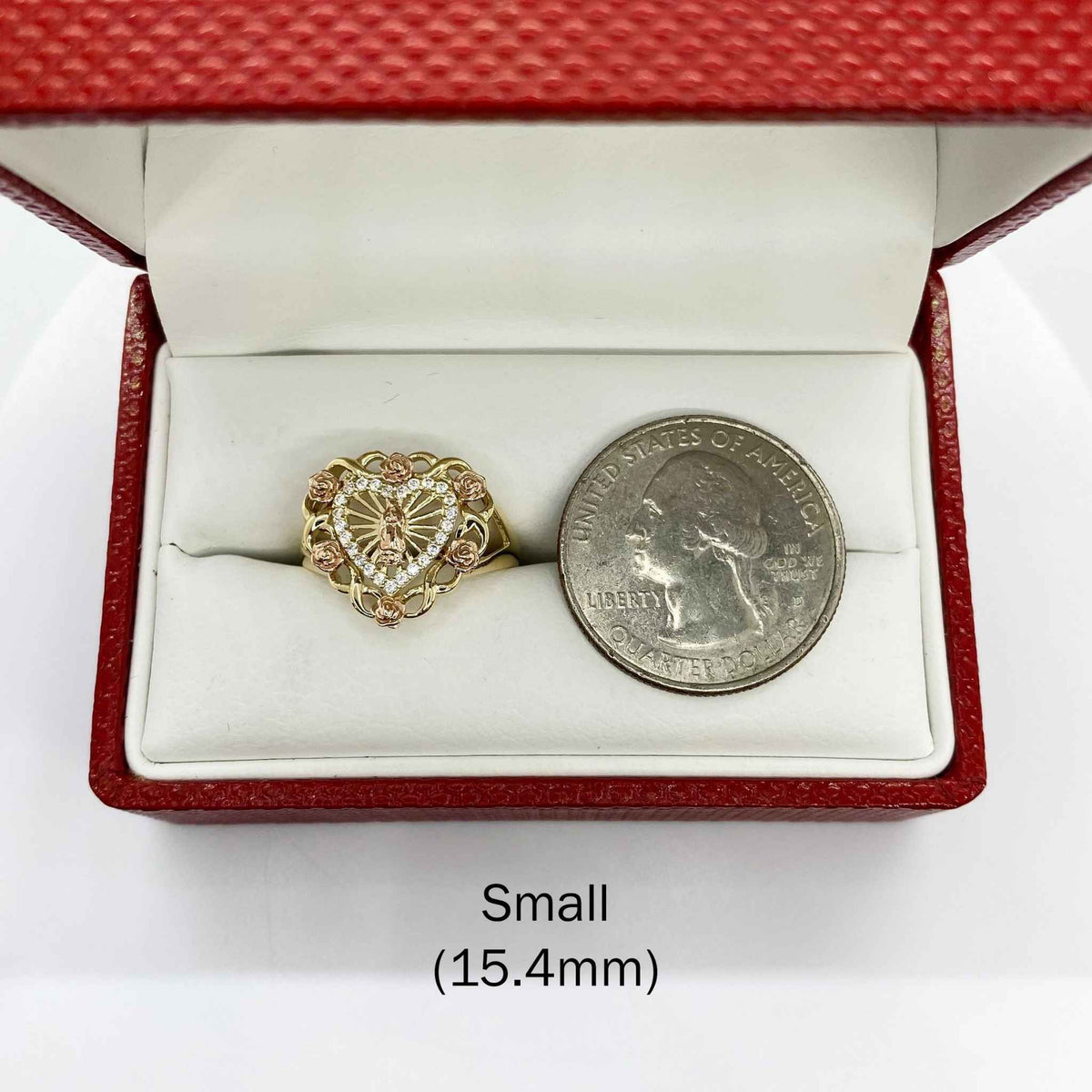 10k - 14k Heart shaped ring with roses in a red box with a quarter for scale on a white background