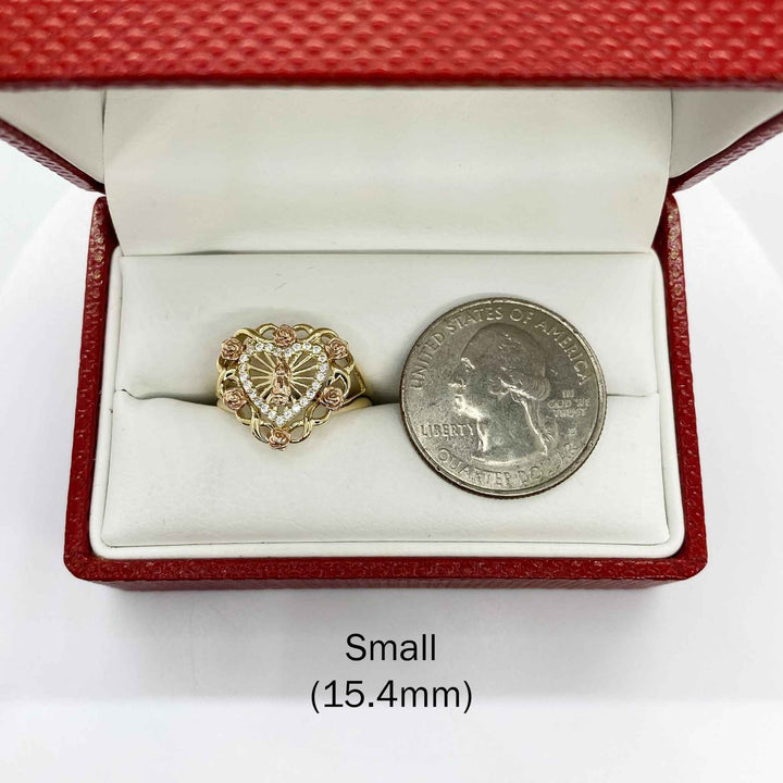 10k - 14k Heart shaped ring with roses in a red box with a quarter for scale on a white background
