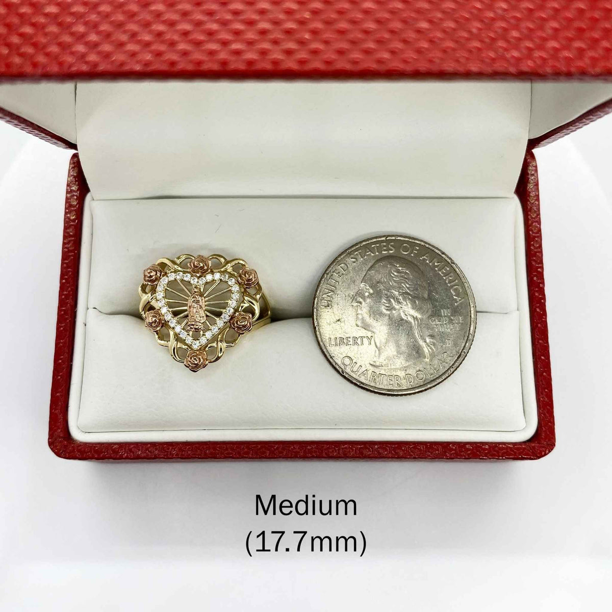 10k - 14k Gold ring with heart design next to a silver dollar bill in a red jewelry box.