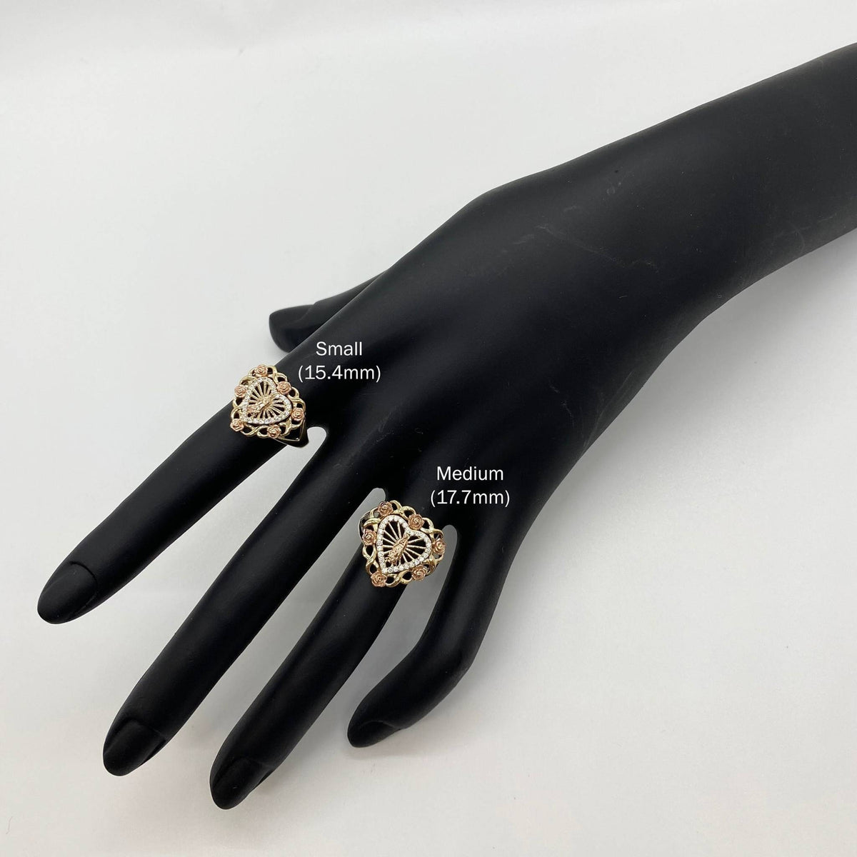 10k - 14k Gold heart shape rings sizes Small 15.4mm and Medium 17.7mm on a black mannequin hand.