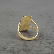 10k - 14k rectangle gold ring back view on a gray surface