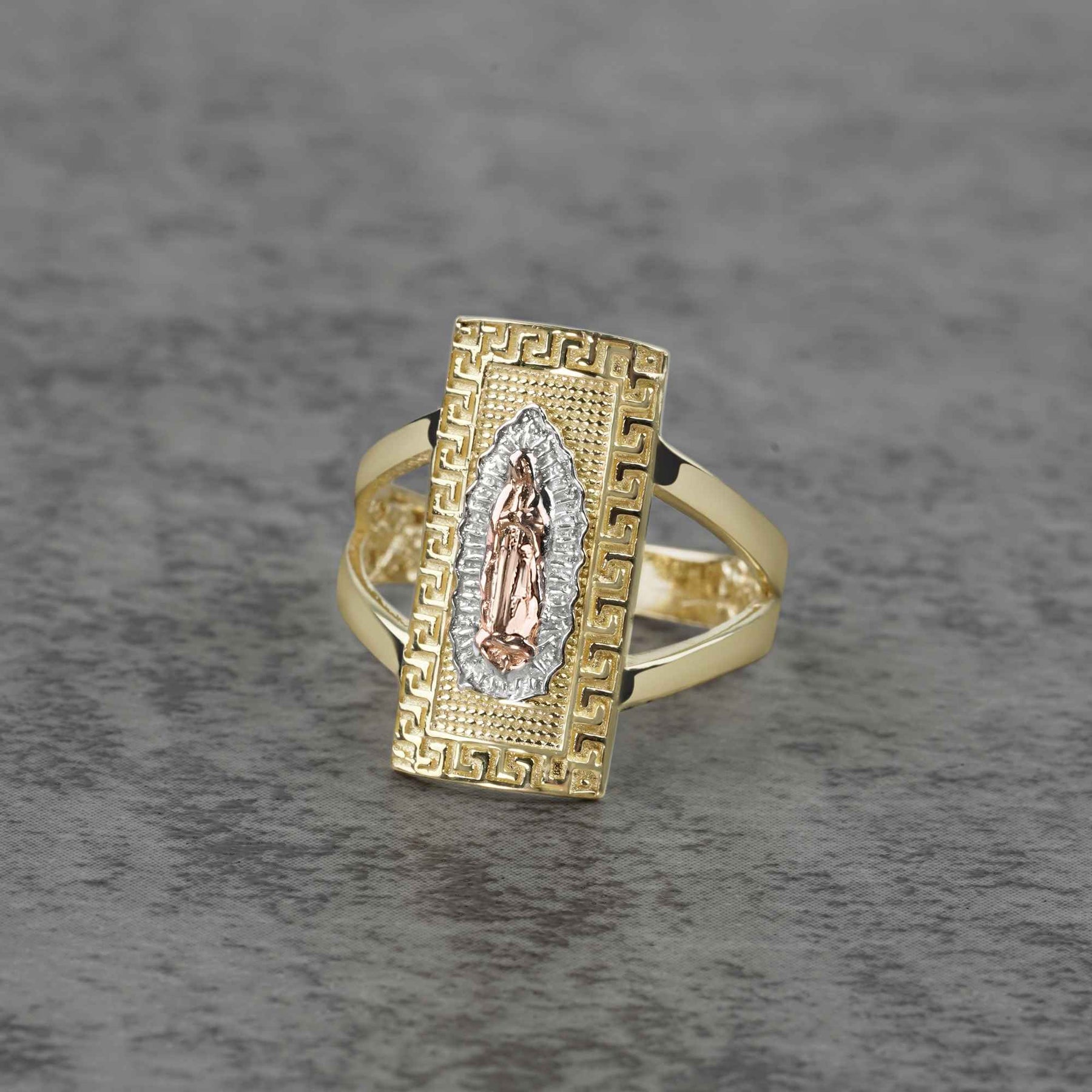 10k - 14k Gold rectangle ring with Virgin Mary design on a gray background