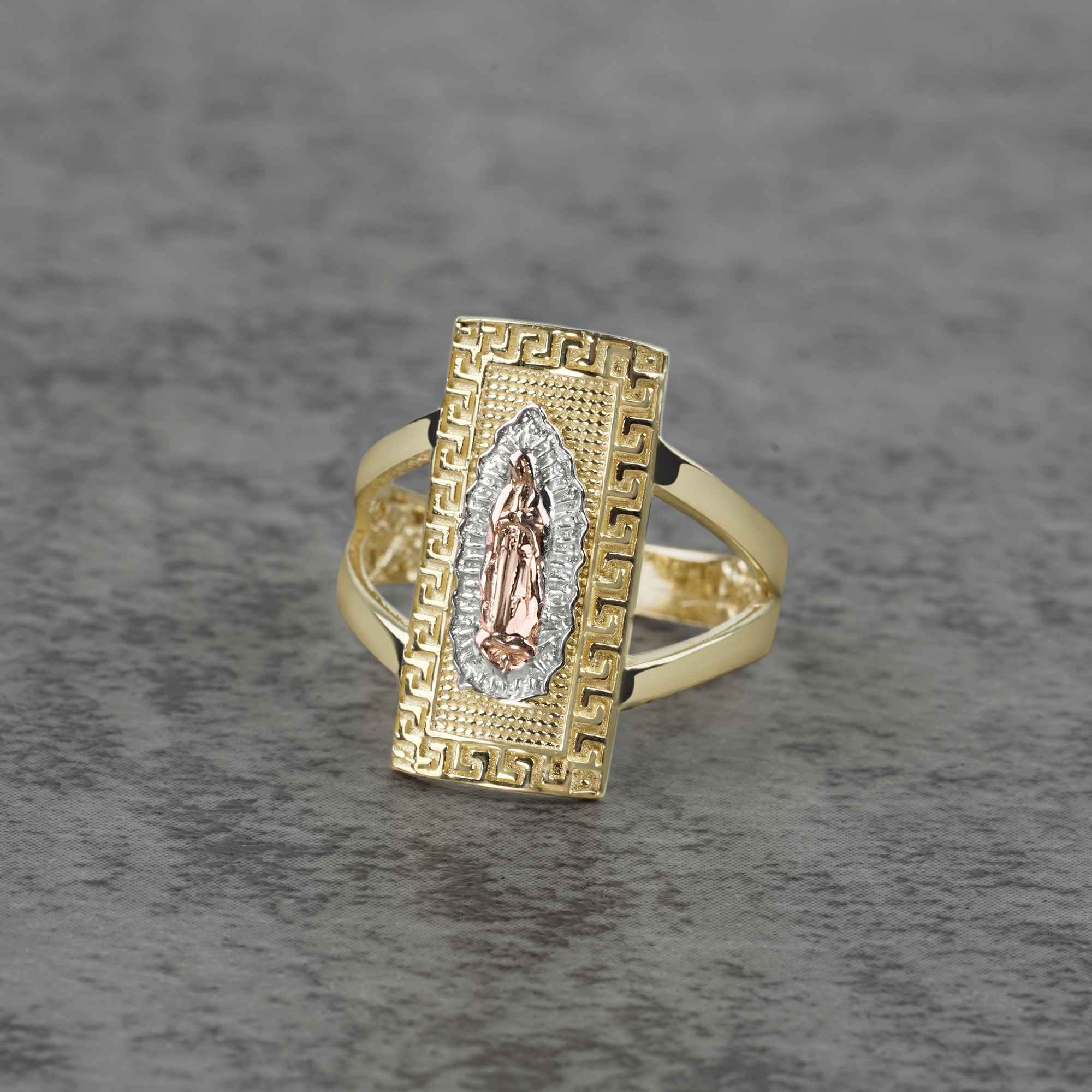 10k - 14k Gold rectangle ring with Virgin Mary design on a gray background
