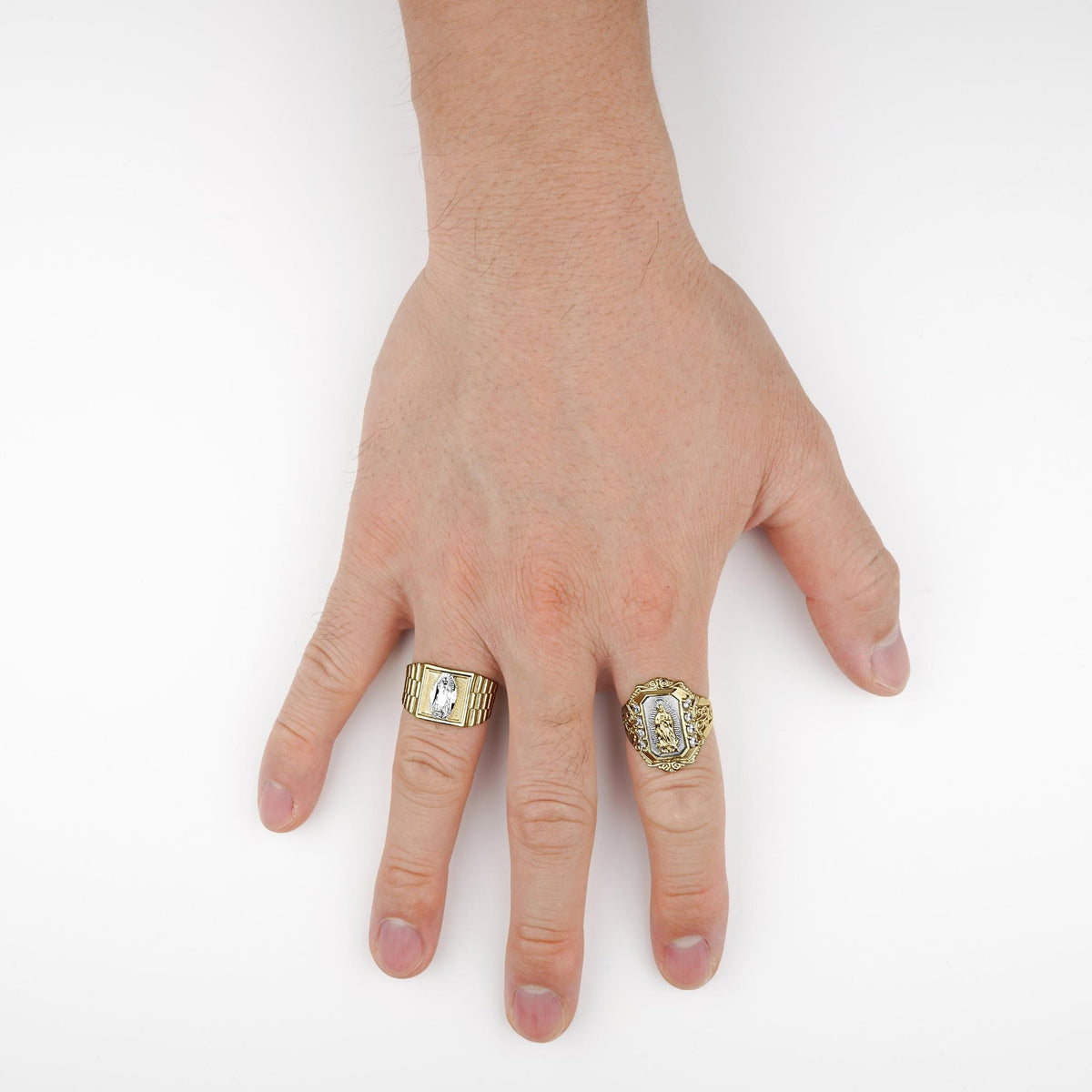 Two-tone gold Virgin Mary ring with cubic zirconia accents worn on a hand.