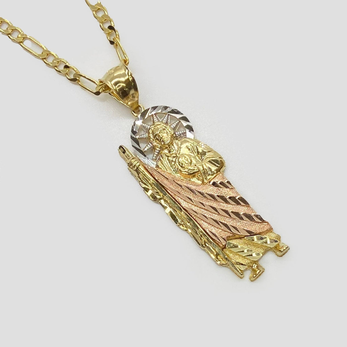 Tri-color gold San Judas Tadeo pendant necklace with diamond-cut finish on Figaro chain.
