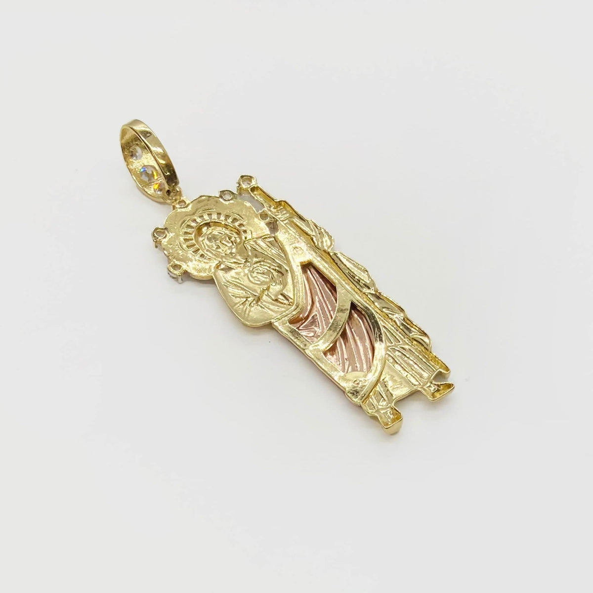 Back view of tri-color gold 3D San Judas pendant isolated on white background.