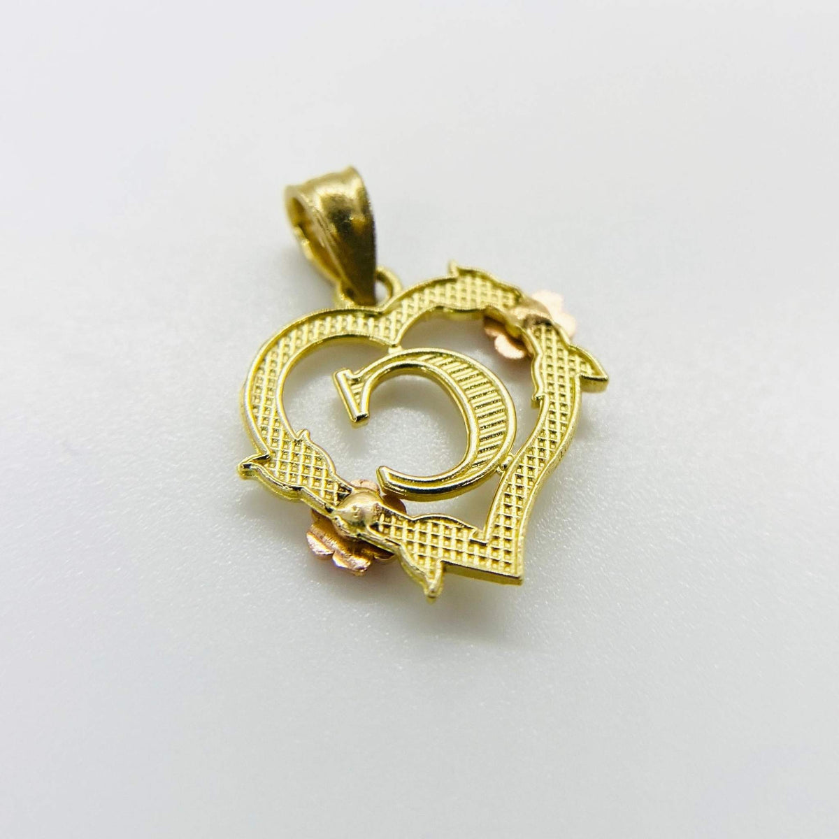 Gold heart-shaped initial pendant featuring a letter C with rose accent on white background.