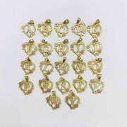 Assortment of two-tone gold heart initial charms featuring rose accents from A to Y.