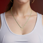 A model wearing the gold heart initial necklace with a white ribbed tank top.
