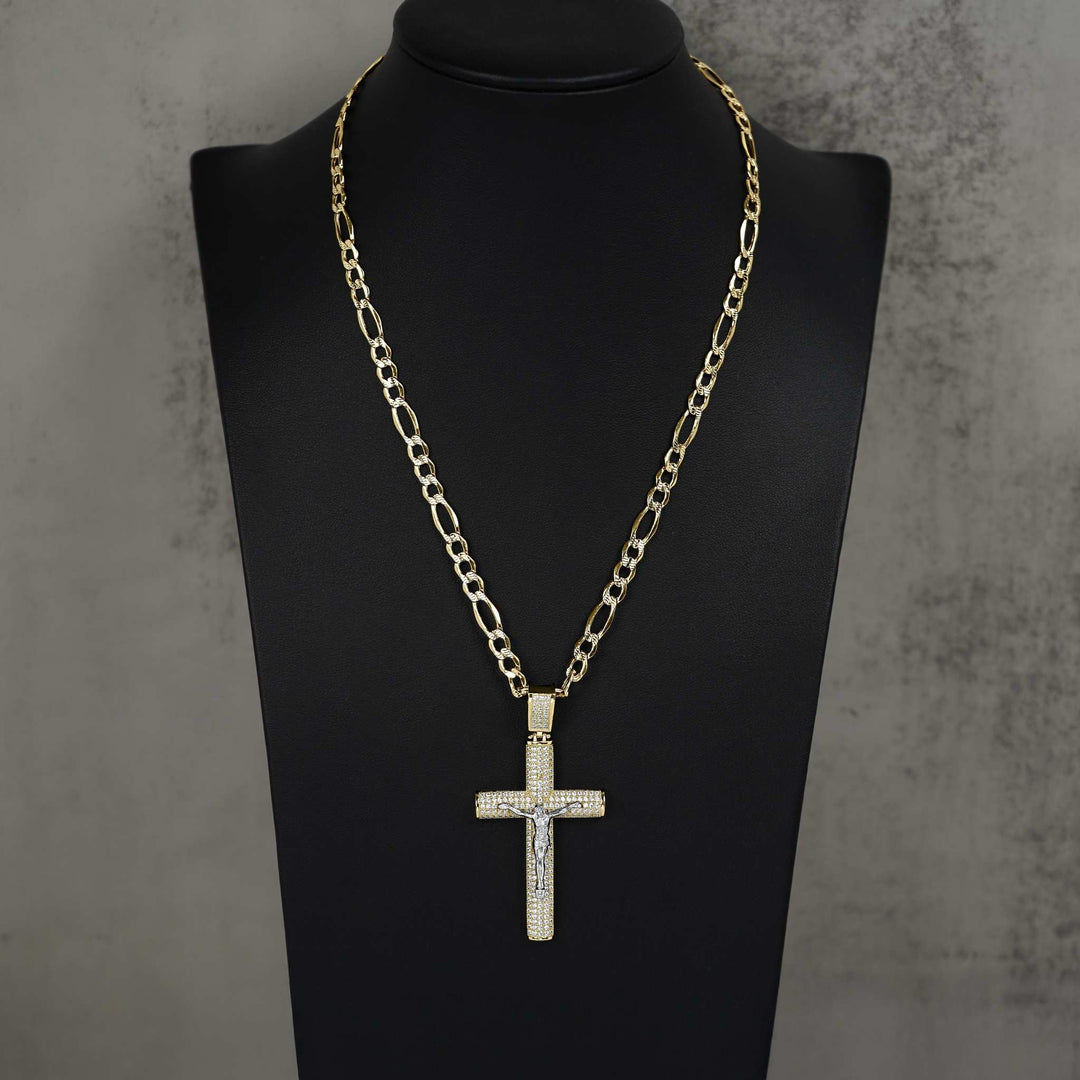 Gold crucifix cross pendant with pavé cubic zirconia stones, displayed on a black mannequin bust.