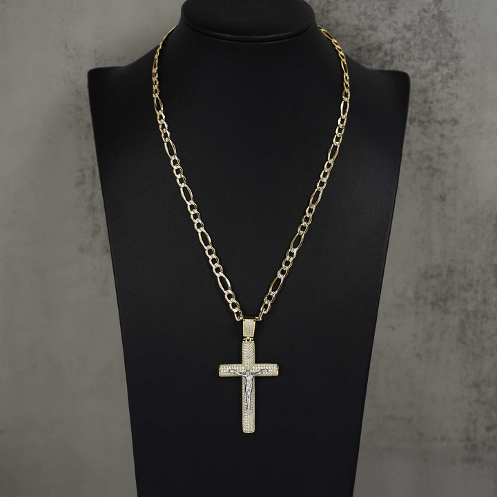 Gold crucifix cross pendant with pavé cubic zirconia stones, displayed on a black mannequin bust.