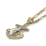 Gold anchor pendant with white gold crucifix cross and paved cubic zirconia on figaro chain.