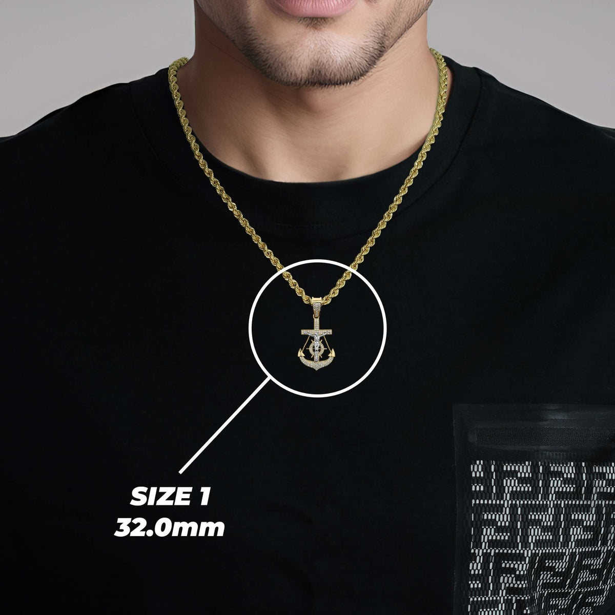 Model wearing Size 1 32.0mm gold anchor and crucifix pendant with highlighted text overlay.